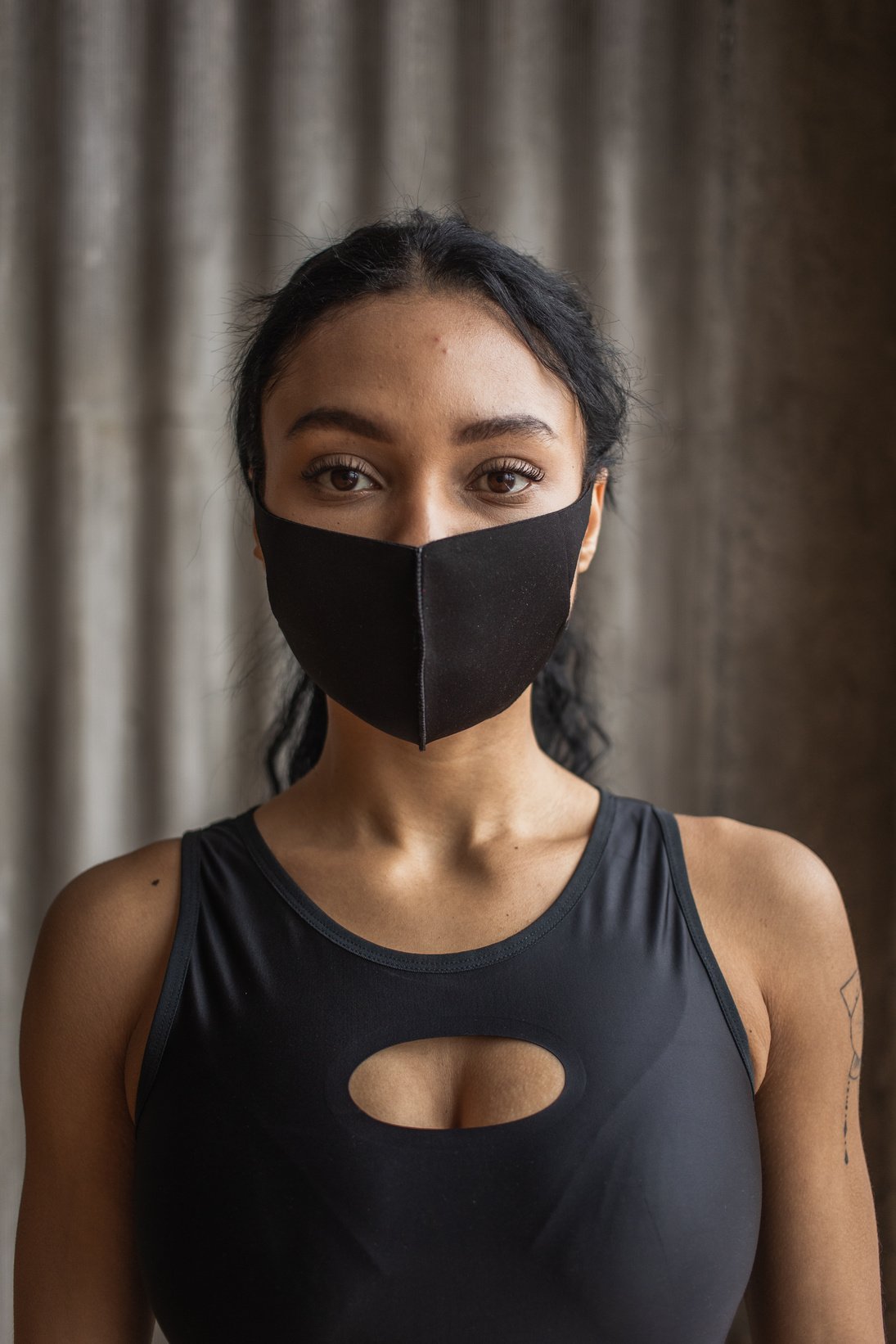 Black woman in cloth face mask during COVID 19 pandemic